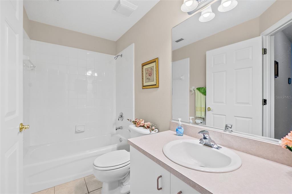 10 Chatham Place, Unit 10 Palm Coast, FL 32164 - Photo 19 of 23 a bathroom with a sink a toilet and shower