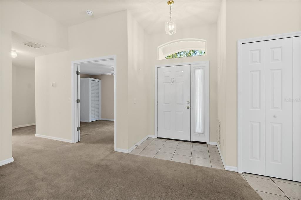 10 Chatham Place, Unit 10 Palm Coast, FL 32164 - Photo 3 of 23 an empty room with closet and a hallway