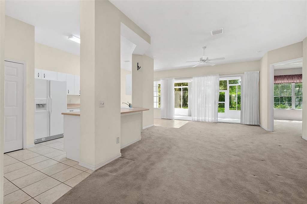 10 Chatham Place, Unit 10 Palm Coast, FL 32164 - Photo 6 of 23 a view of a big room with windows and entryway