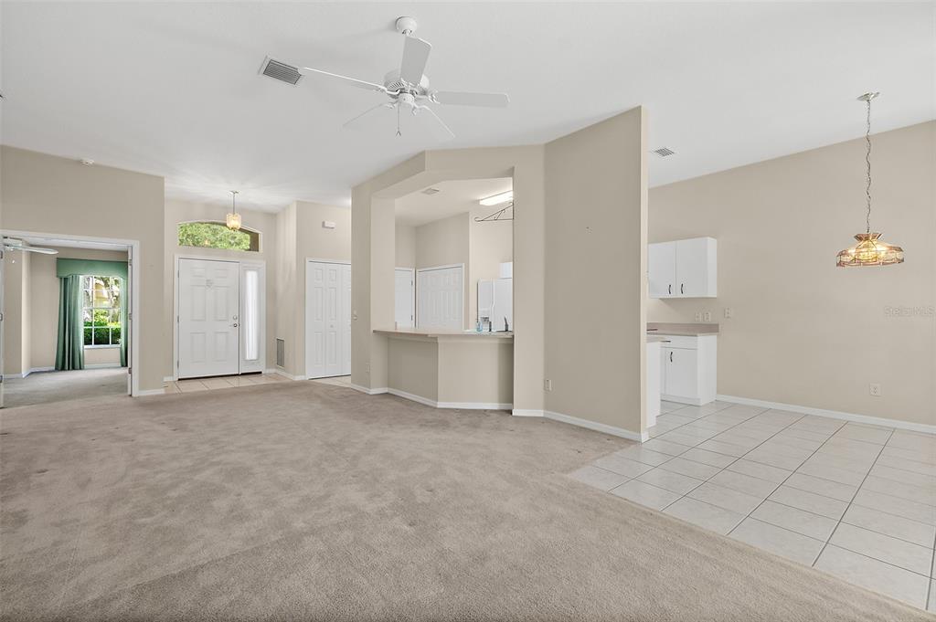 10 Chatham Place, Unit 10 Palm Coast, FL 32164 - Photo 8 of 23 an empty room with fan and windows