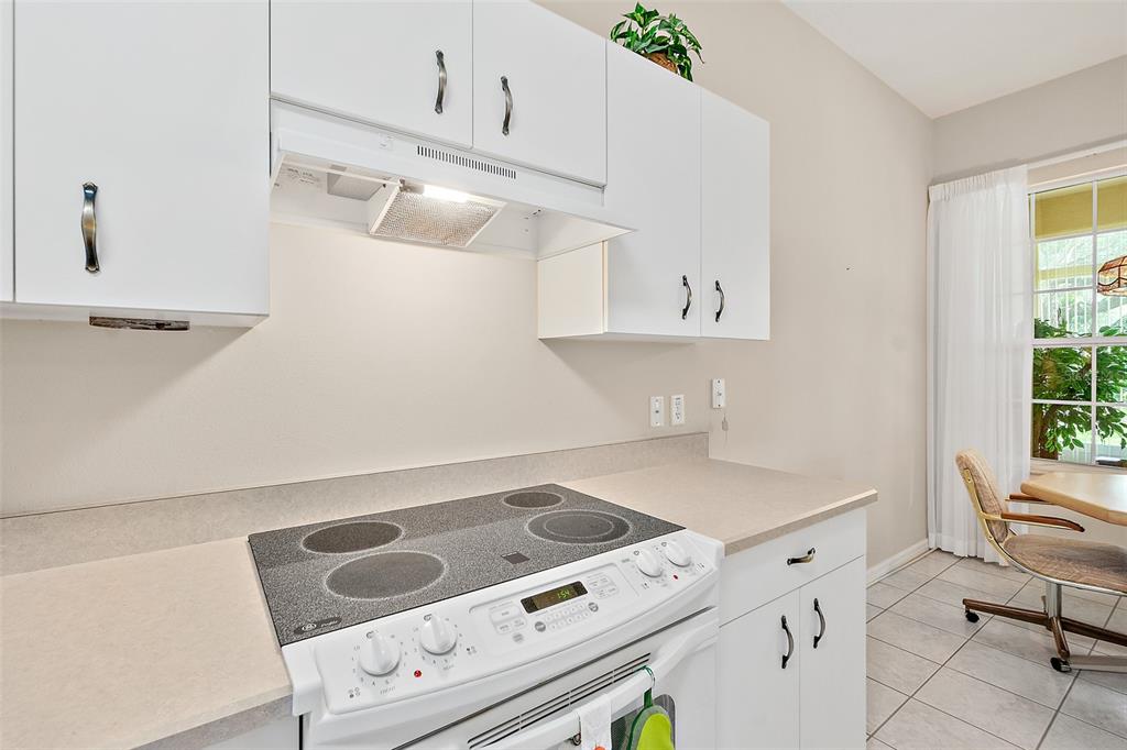 10 Chatham Place, Unit 10 Palm Coast, FL 32164 - Photo 10 of 23 a kitchen with a sink cabinets and appliances
