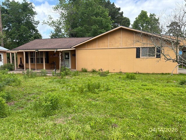 1301 Minglewood Road Liberty, TX 77575 - Photo 2 of 6 a view of a house with backyard