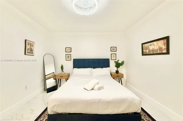 a bedroom with a bed and a dresser