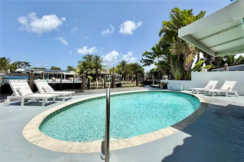 a view of a swimming pool with a patio