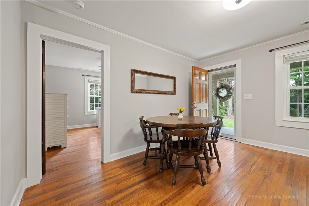 174 Holliday Road Six Mile, SC 29682 - Photo 10 of 49 Rich hardwood floors welcome you into this inviting dining area, connecting effortlessly to additional living spaces