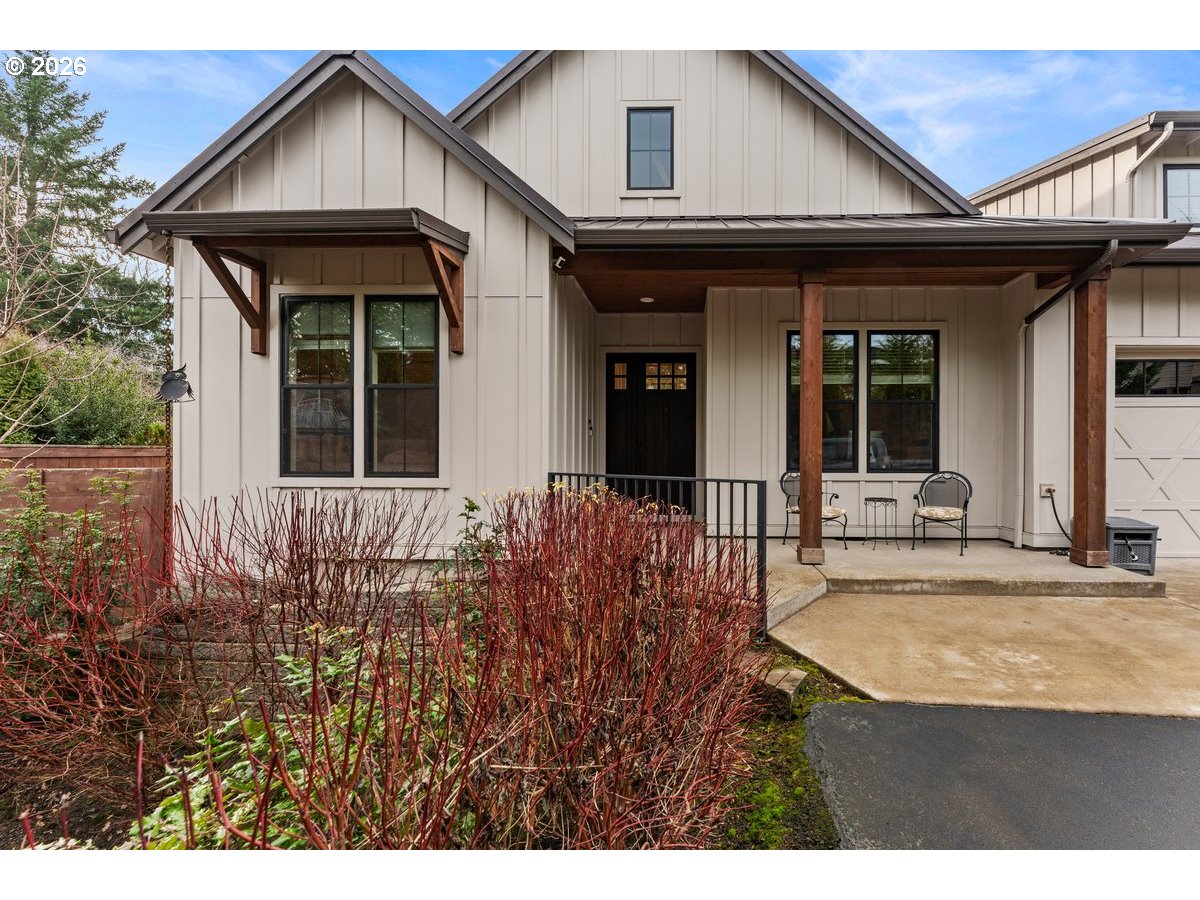 7405 Southwest 77th Avenue Portland, OR 97223 - Photo 1 of 47 a view of a house with potted plants and a yard