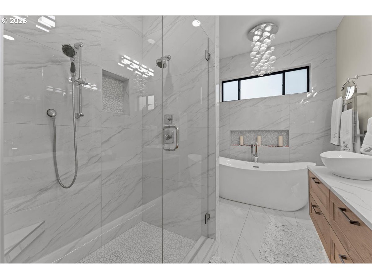 7405 Southwest 77th Avenue Portland, OR 97223 - Photo 24 of 47 a bathroom with a tub sink mirror and shower