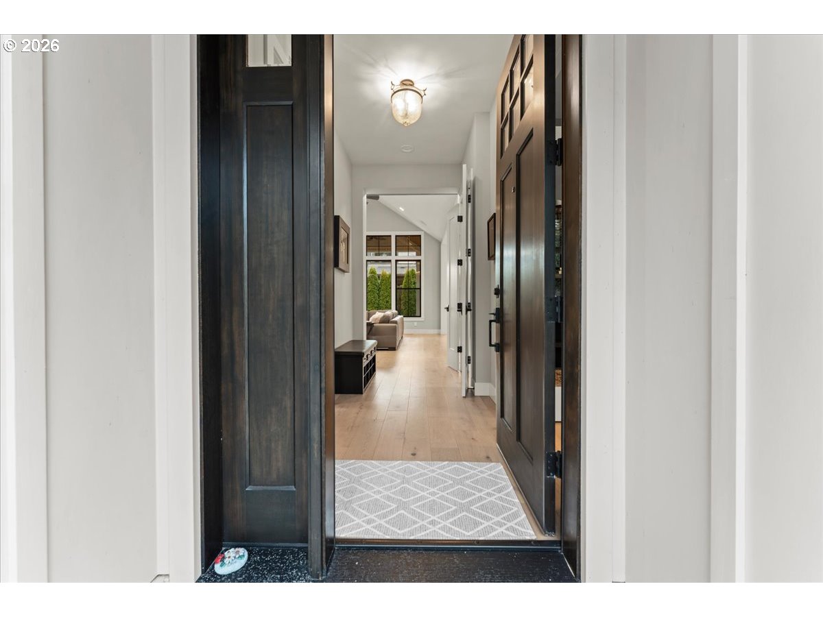 7405 Southwest 77th Avenue Portland, OR 97223 - Photo 3 of 47 a view of a hallway with wooden floor