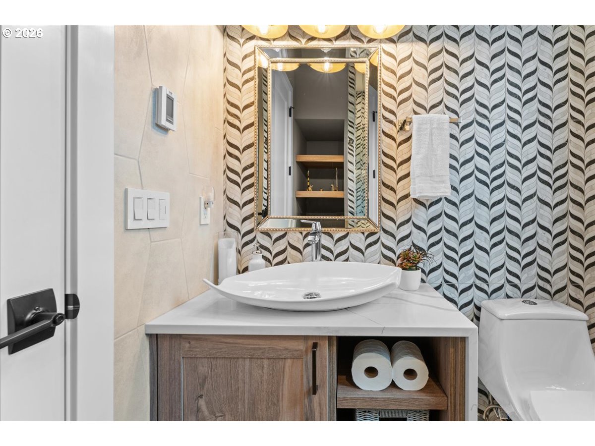 7405 Southwest 77th Avenue Portland, OR 97223 - Photo 32 of 47 a bathroom with a sink and a mirror