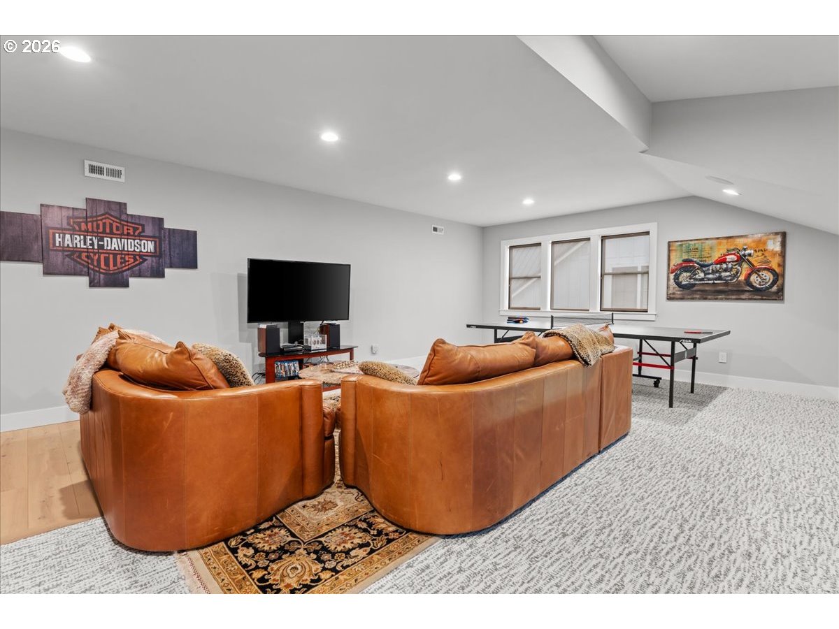 7405 Southwest 77th Avenue Portland, OR 97223 - Photo 35 of 47 a living room with furniture and a flat screen tv