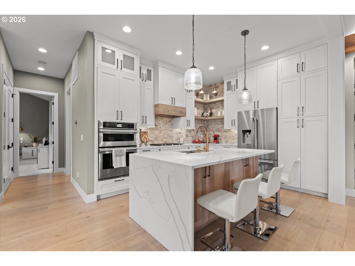 7405 Southwest 77th Avenue Portland, OR 97223 - Photo 10 of 47 a large kitchen with a table and chairs