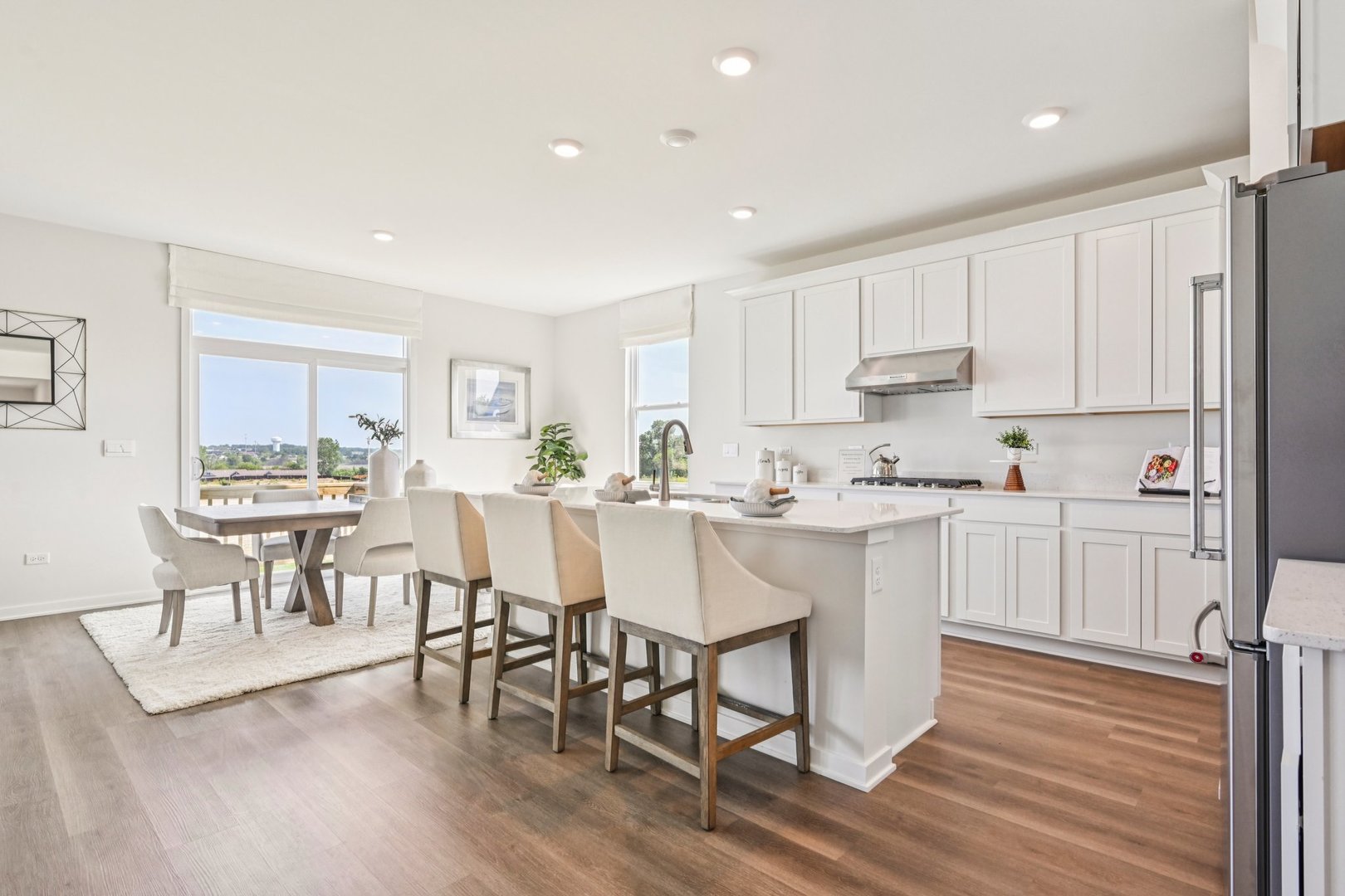 278 Snowdrop Lane Elgin, IL 60124 - Photo 7 of 54 a kitchen with a dining table chairs and wooden floor