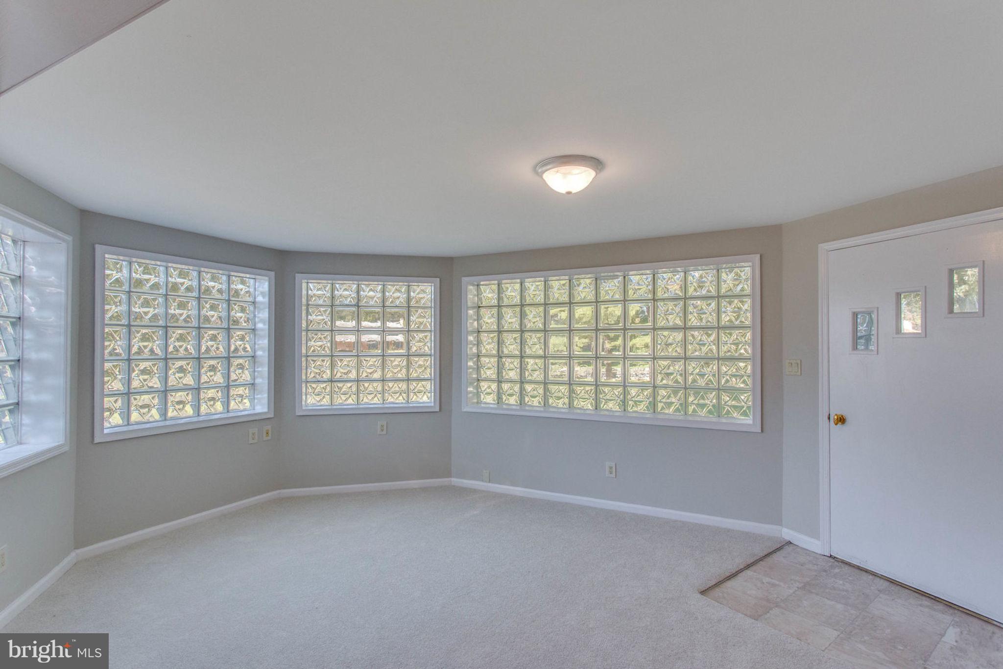 4636 Guinea Road Fairfax, VA 22032 - Photo 22 of 28 Basement Sunroom walks out to Back Yard