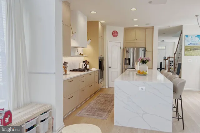 a kitchen with a sink stove and refrigerator