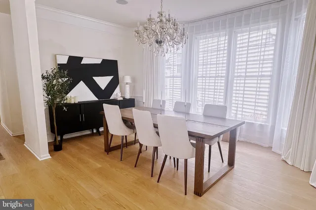 a view of a dining room with furniture and window