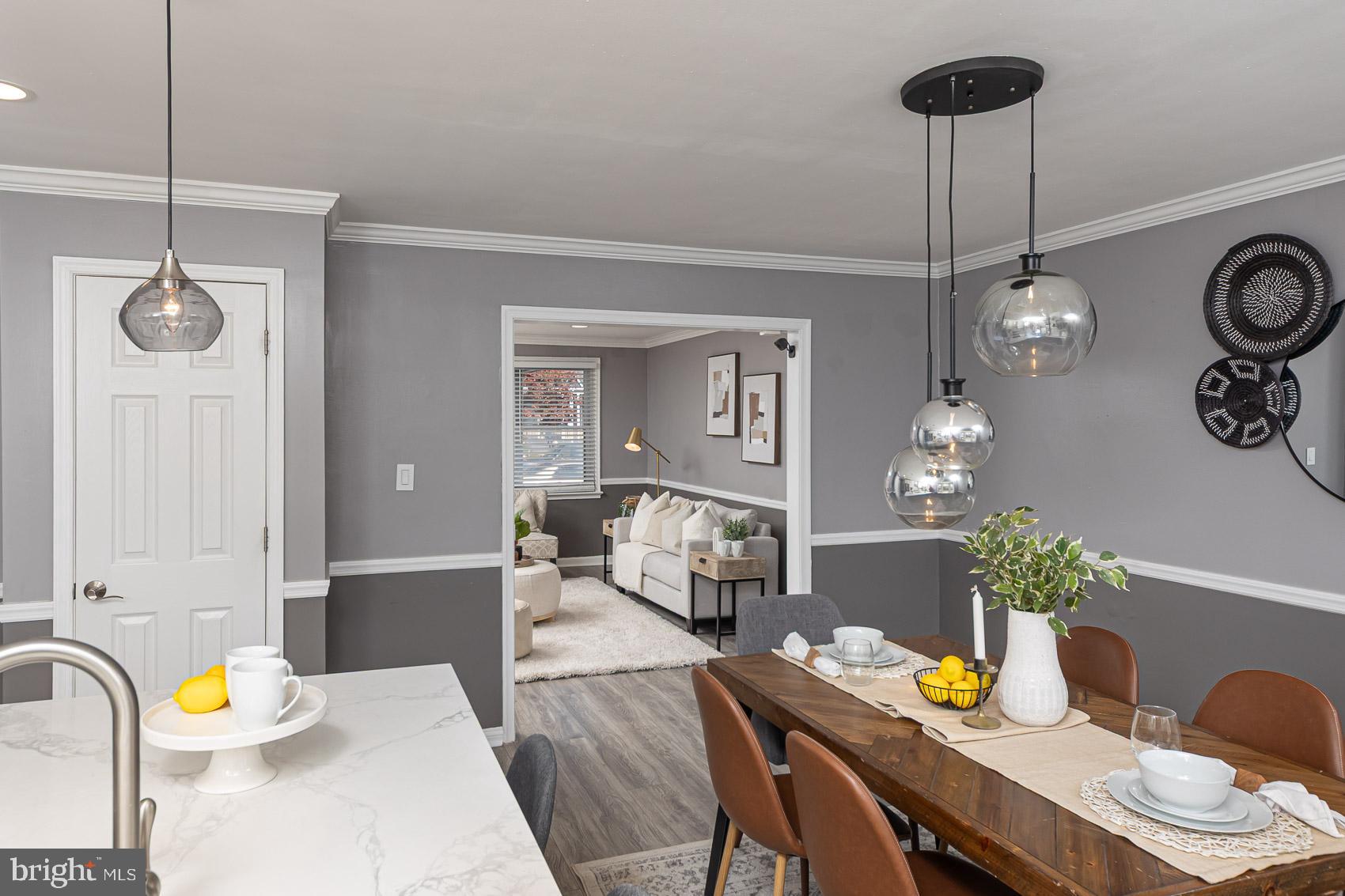 1809 Northbourne Road Baltimore, MD 21239 - Photo 11 of 43 a view of a dining room with furniture and chandelier