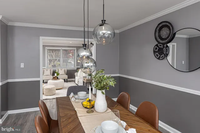a dining room with furniture and wooden floor