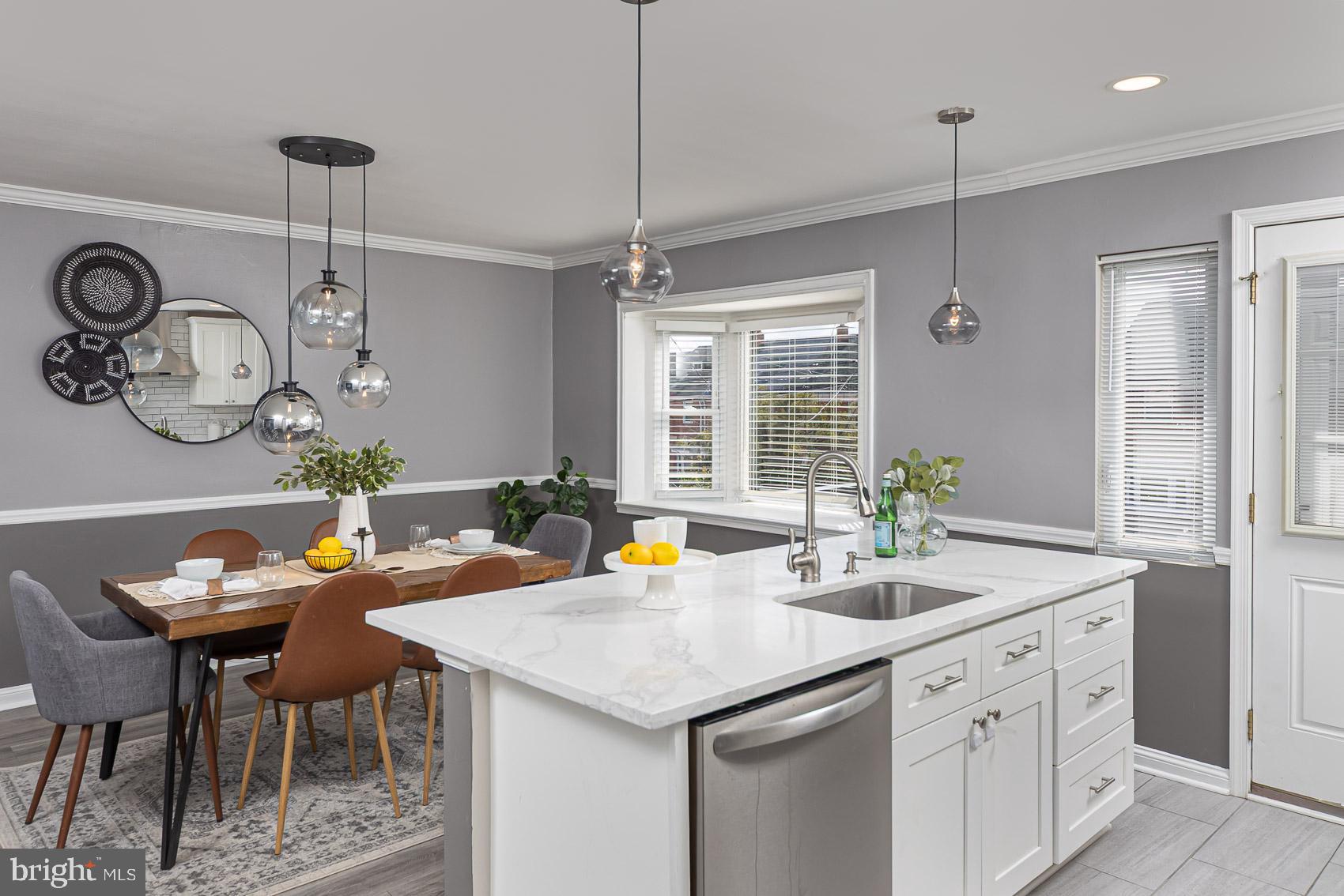 1809 Northbourne Road Baltimore, MD 21239 - Photo 15 of 43 a kitchen with a sink appliances and a table