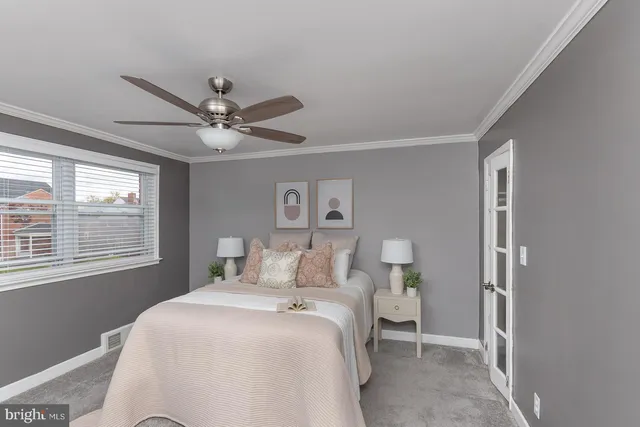 a bedroom with a large bed and a window