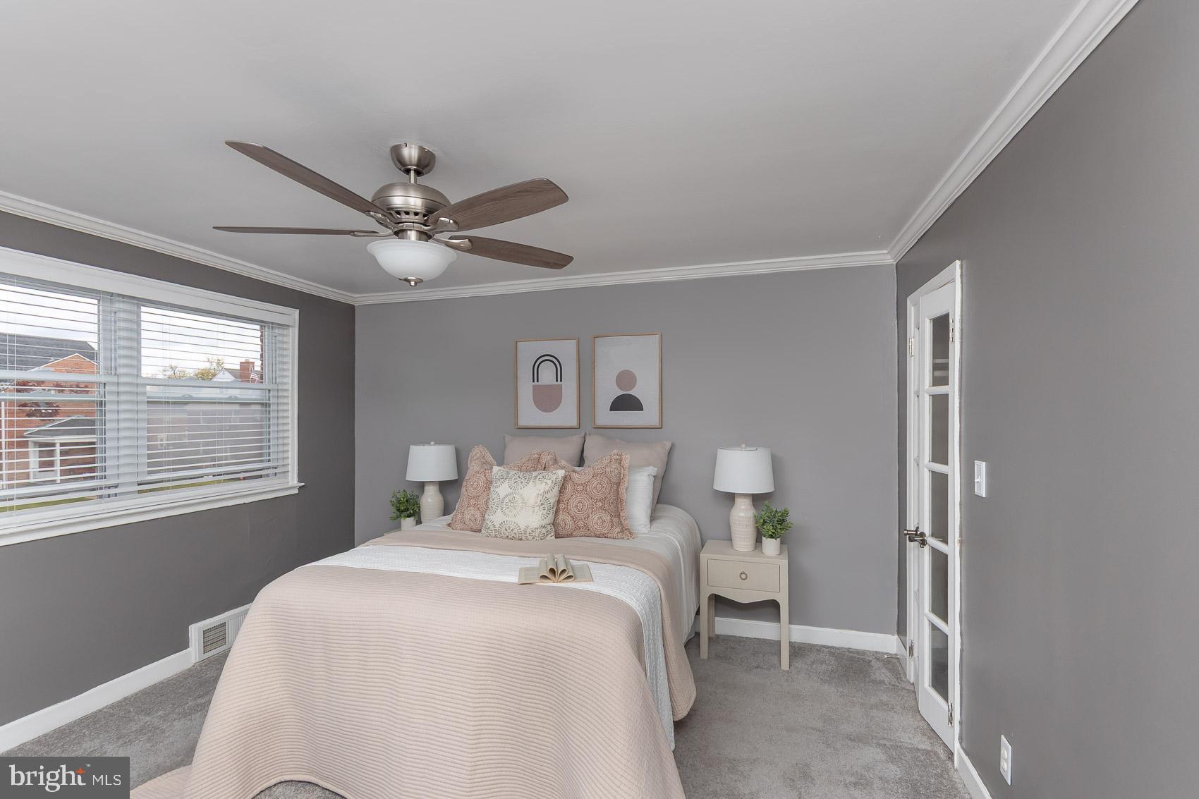 1809 Northbourne Road Baltimore, MD 21239 - Photo 20 of 43 a bedroom with a large bed and a window