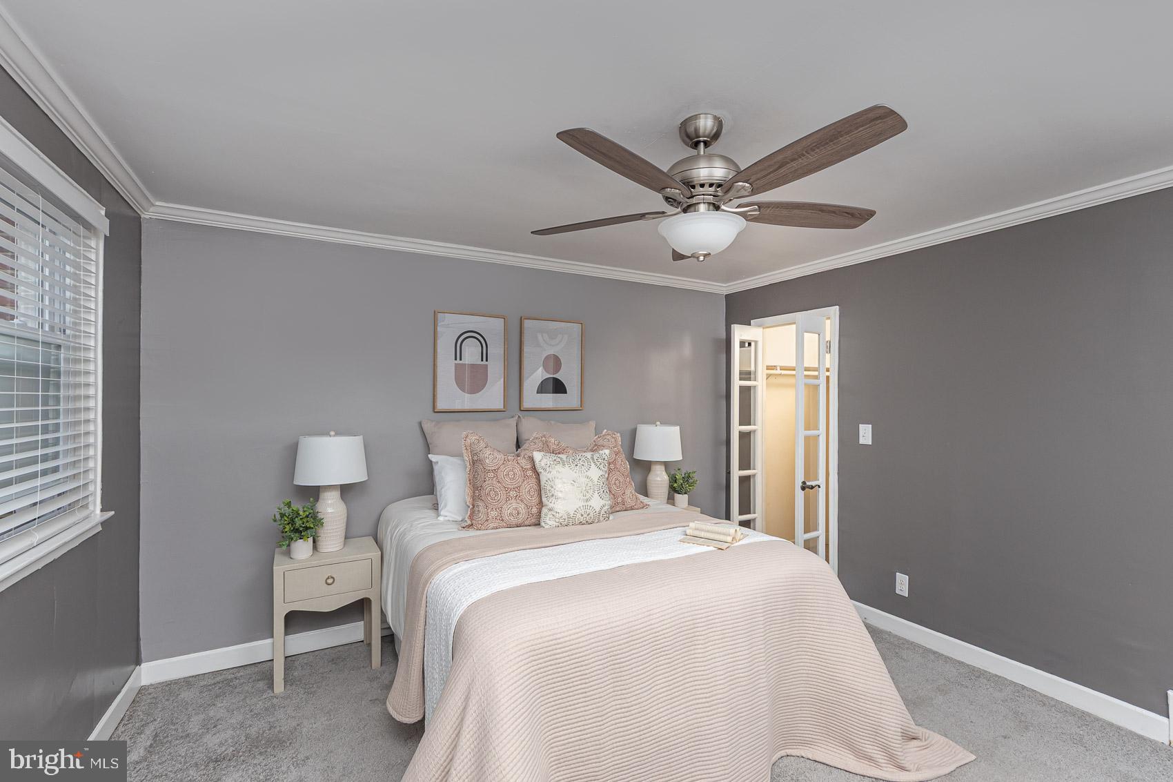 1809 Northbourne Road Baltimore, MD 21239 - Photo 21 of 43 a bedroom with a bed and a ceiling fan