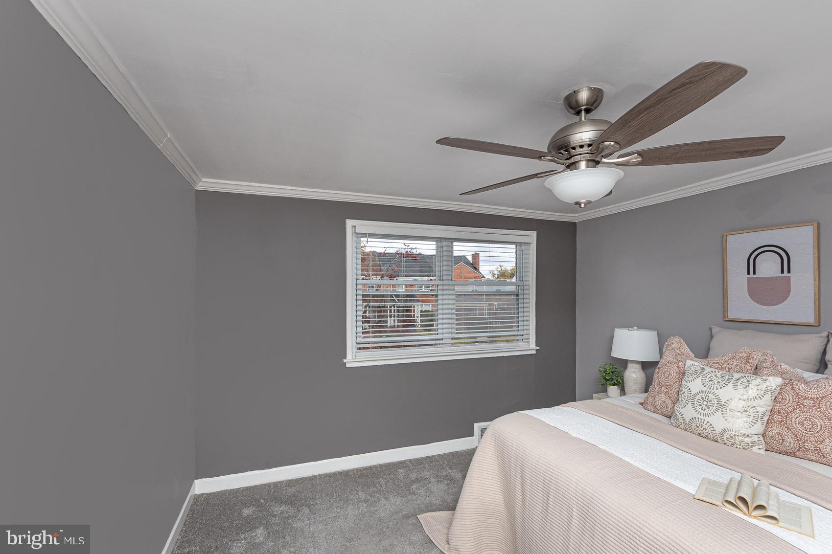 1809 Northbourne Road Baltimore, MD 21239 - Photo 22 of 43 a bedroom with a large bed and a window