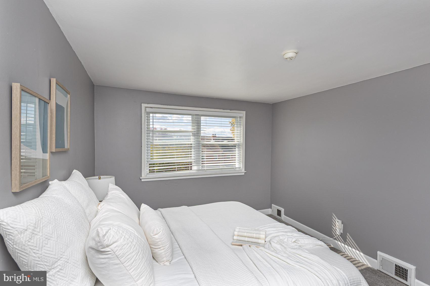 1809 Northbourne Road Baltimore, MD 21239 - Photo 25 of 43 a bedroom with a bed and a window