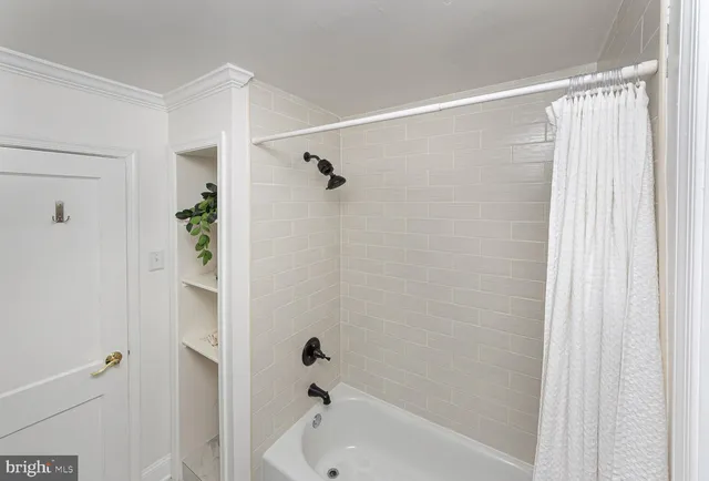 a bathroom with a shower and a tub