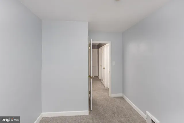 a view of hallway with closet