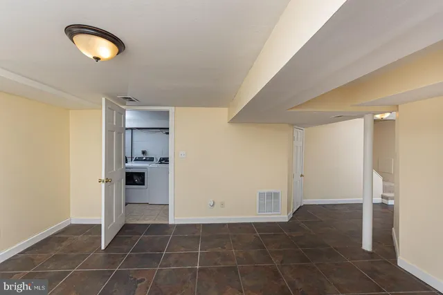 a view of a kitchen with a sink