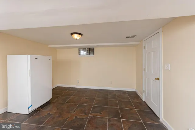 a view of a storage & utility room with a sink