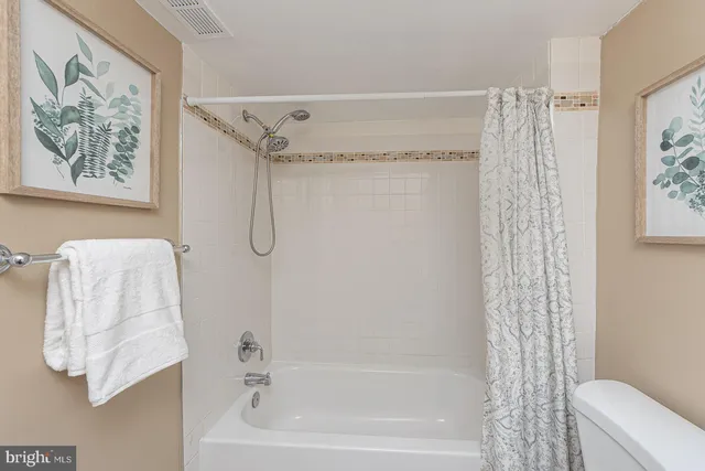a bathroom with a shower curtain
