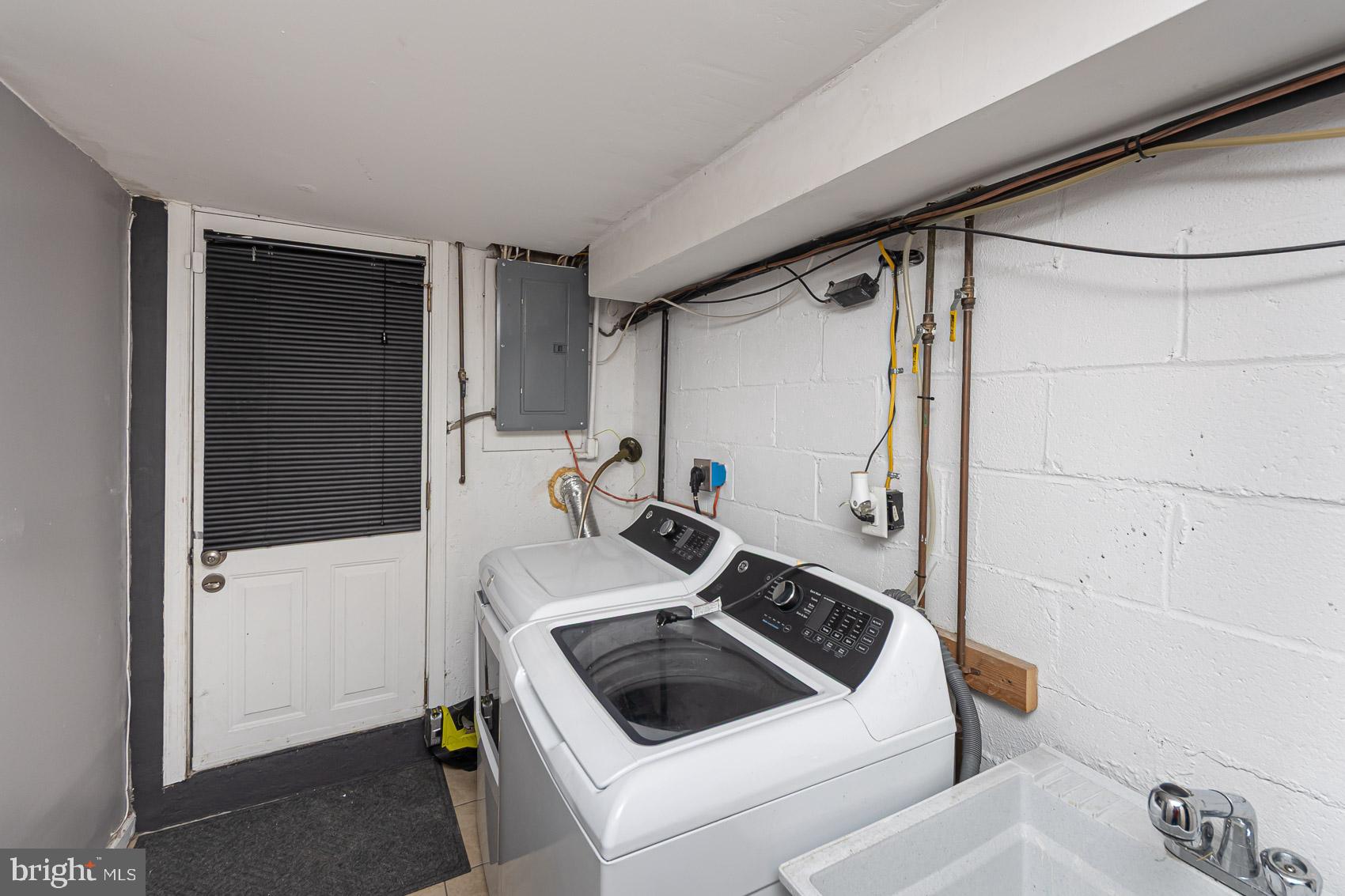 1809 Northbourne Road Baltimore, MD 21239 - Photo 39 of 43 a bathroom with a sink a toilet and shower