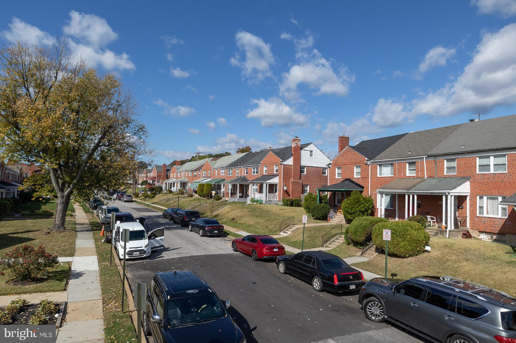 1809 Northbourne Road Baltimore, MD 21239 - Photo 43 of 43 a front view of a building with cars parked
