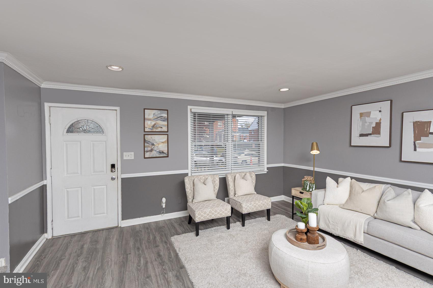 1809 Northbourne Road Baltimore, MD 21239 - Photo 5 of 43 a living room with furniture and wooden floor
