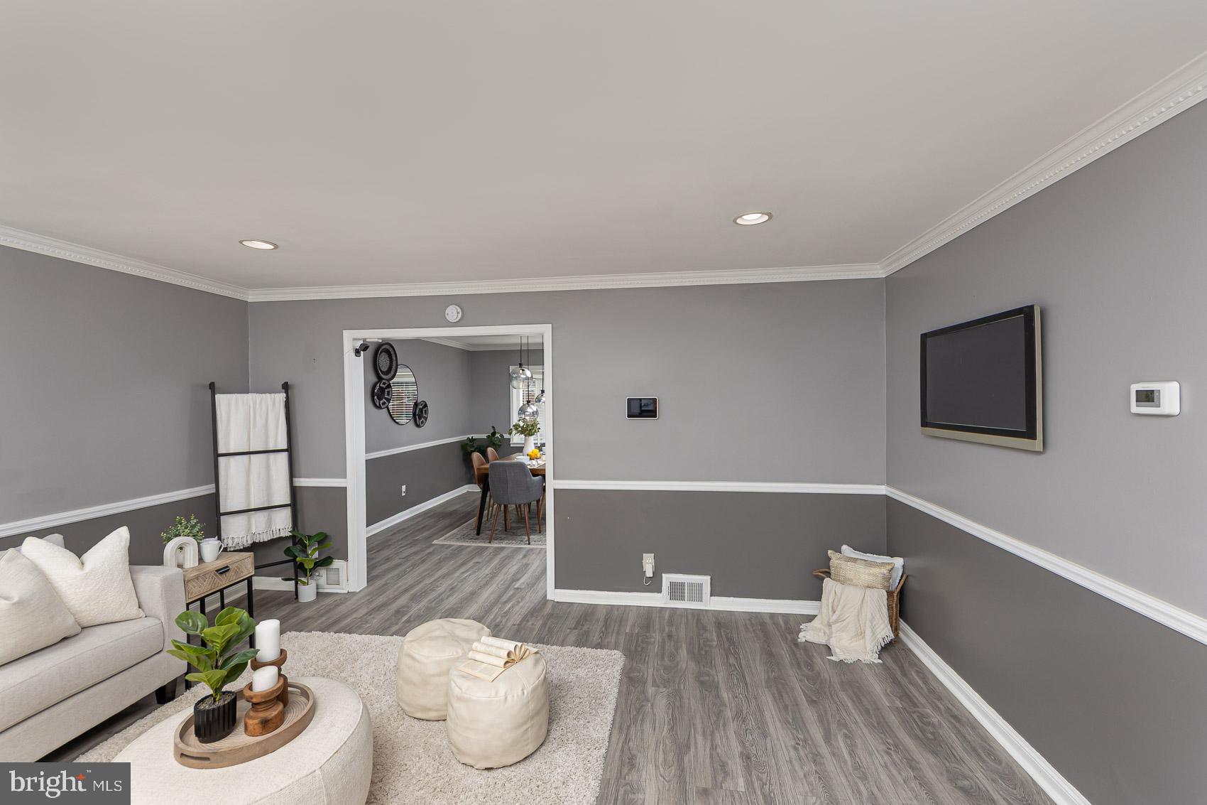1809 Northbourne Road Baltimore, MD 21239 - Photo 8 of 43 a living room with furniture and a wooden floor