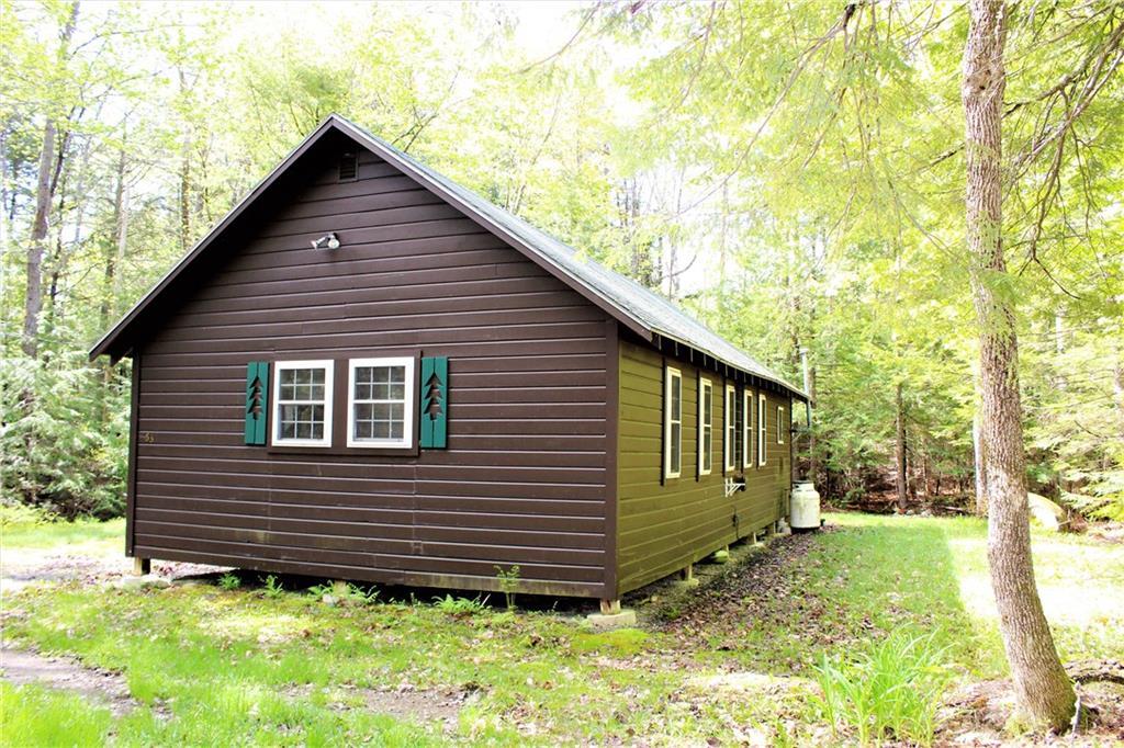 63 Cedar Camp Road Belgrade, ME 04917 - Photo 17 of 17 Side view of cottage and back of...