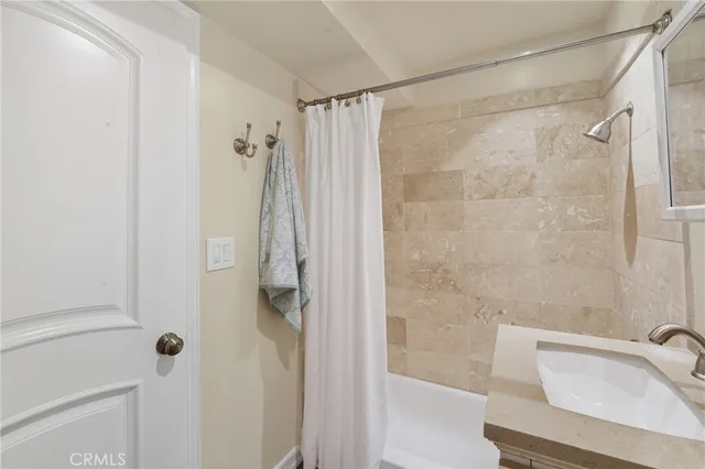 a bathroom with a shower and a tub