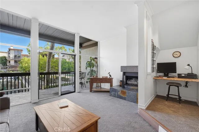 a workspace with furniture and a window