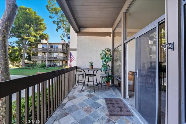 a view of a porch with potted plants