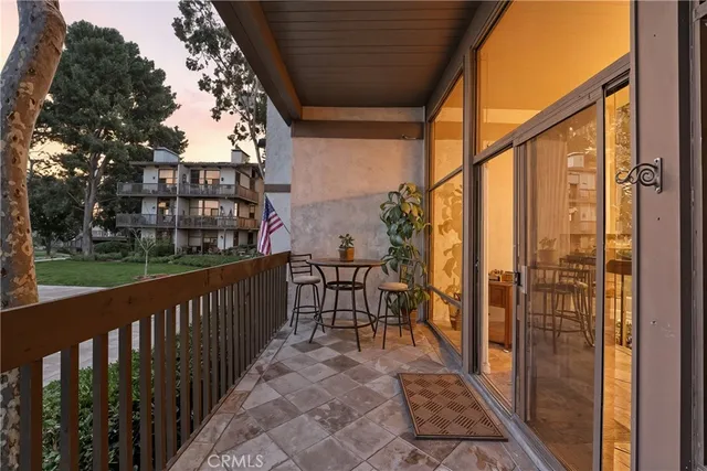 a view of a balcony with furniture