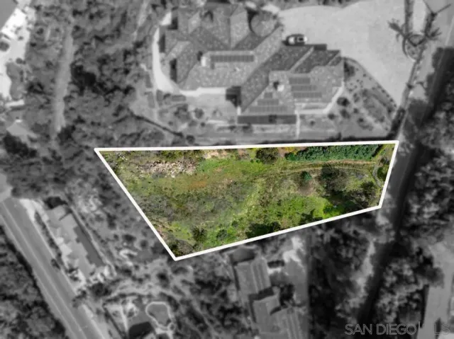 a aerial view of a house with a yard