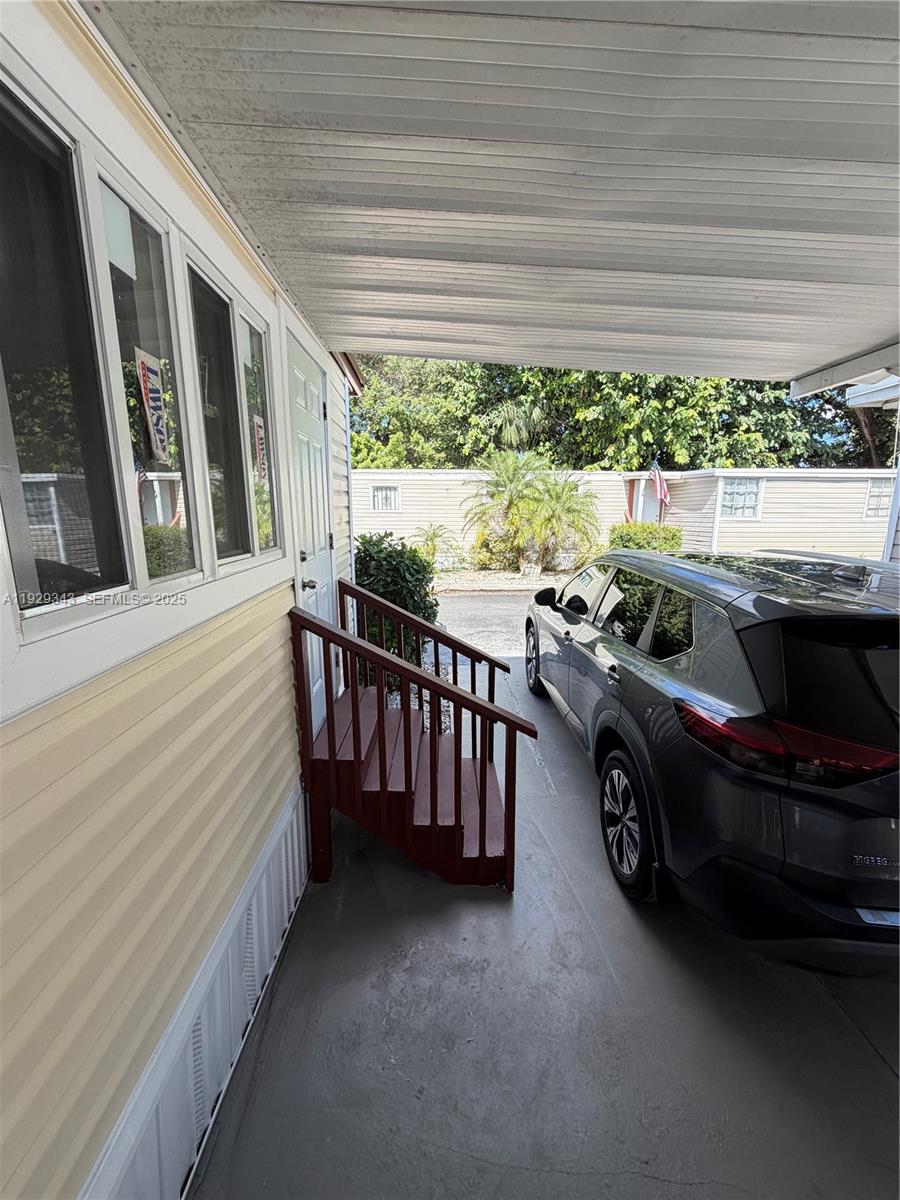 2980 Northwest 79th Street, Unit C Miami, FL 33147 - Photo 2 of 5 a car parked in front of a house