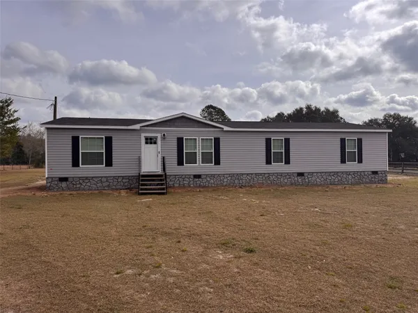 front view of a house with yard