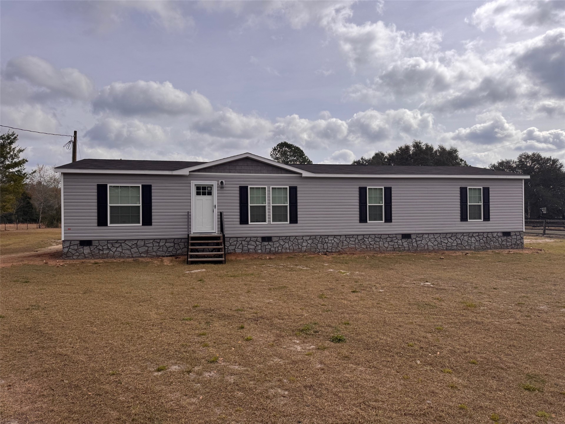 273535 Murrhee Road Hilliard, FL 32046 - Photo 1 of 25 front view of a house with yard