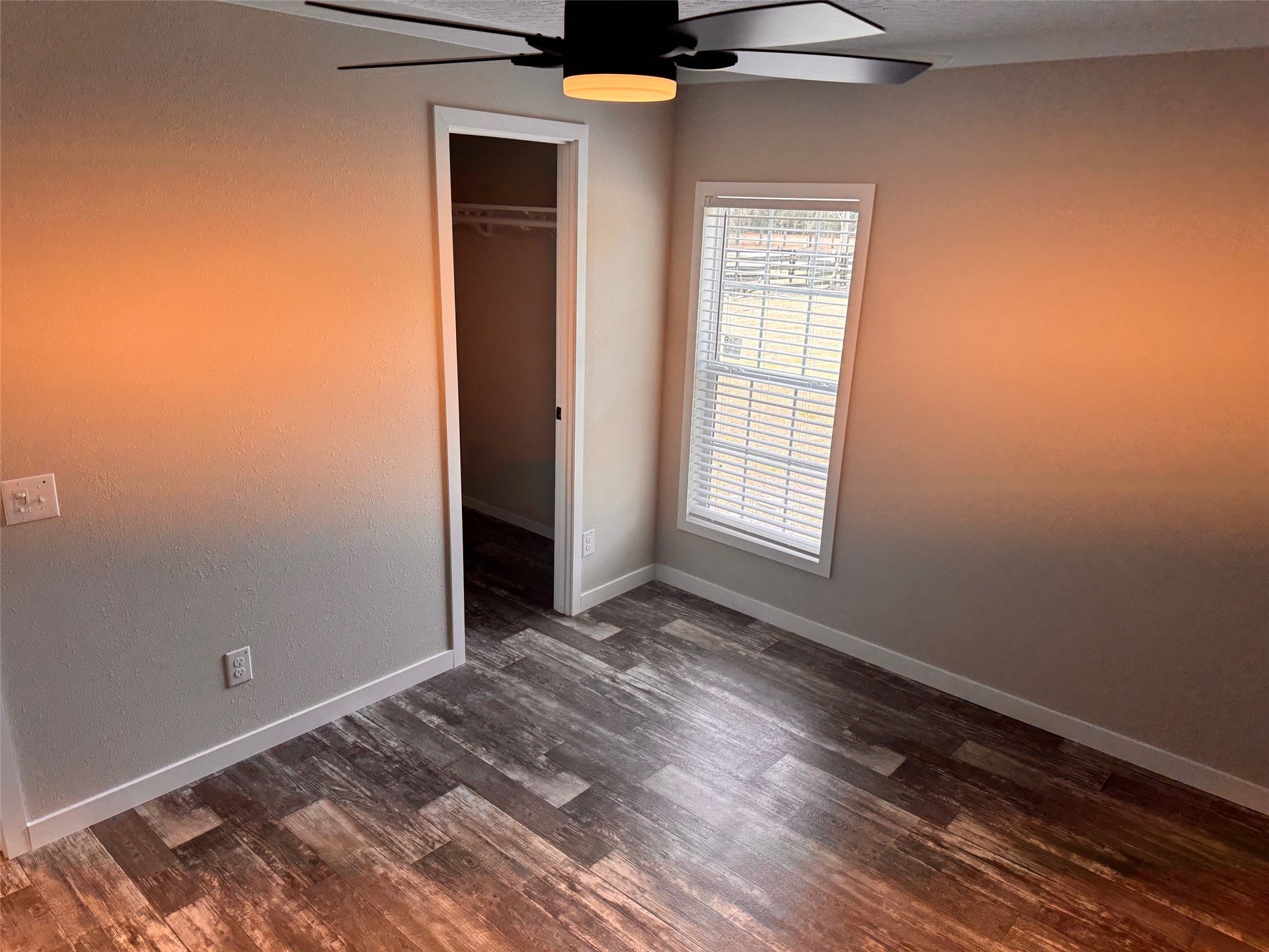273535 Murrhee Road Hilliard, FL 32046 - Photo 20 of 25 a view of an empty room with wooden floor and a window