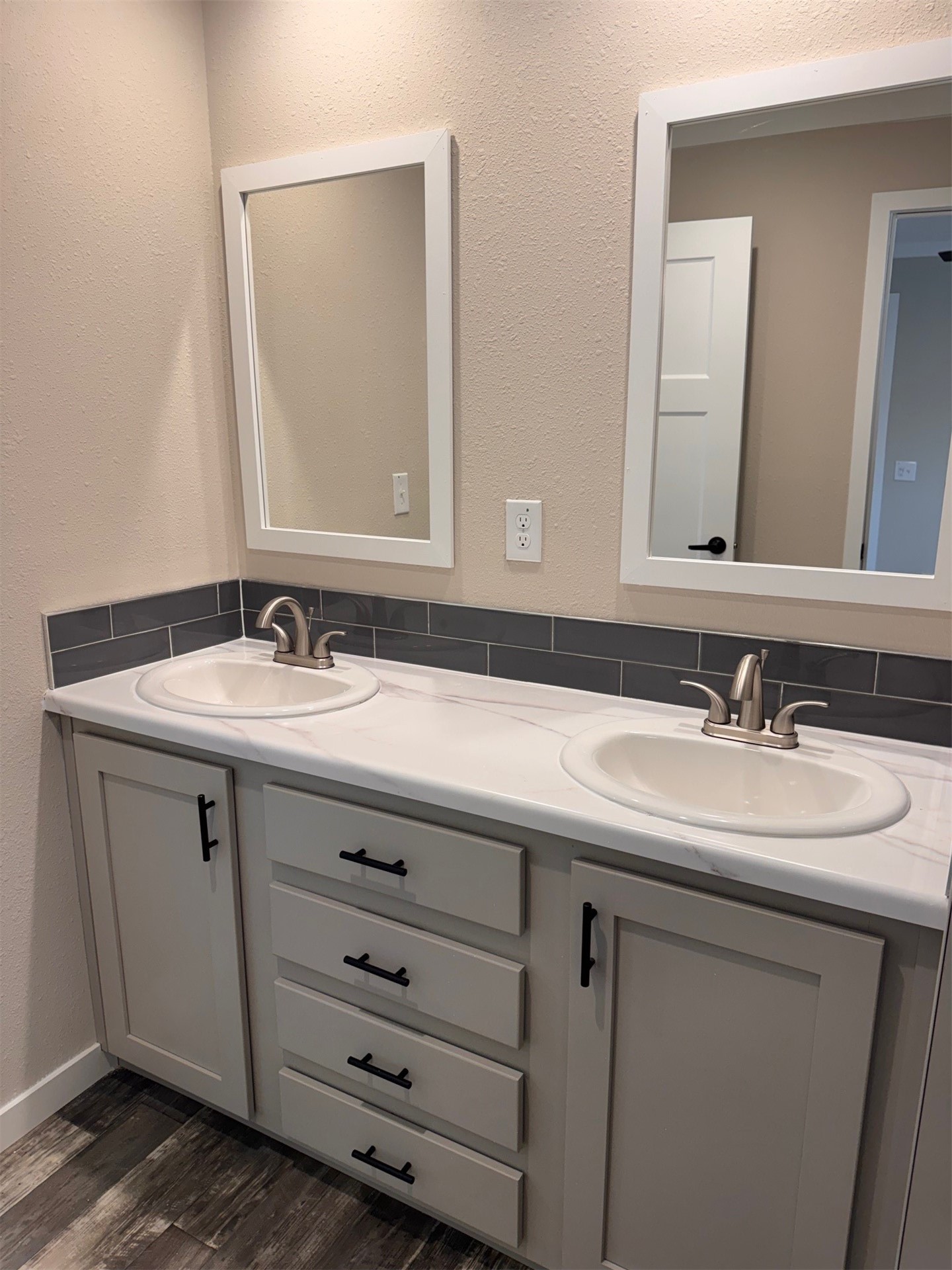 273535 Murrhee Road Hilliard, FL 32046 - Photo 22 of 25 a bathroom with a double vanity sink and mirror