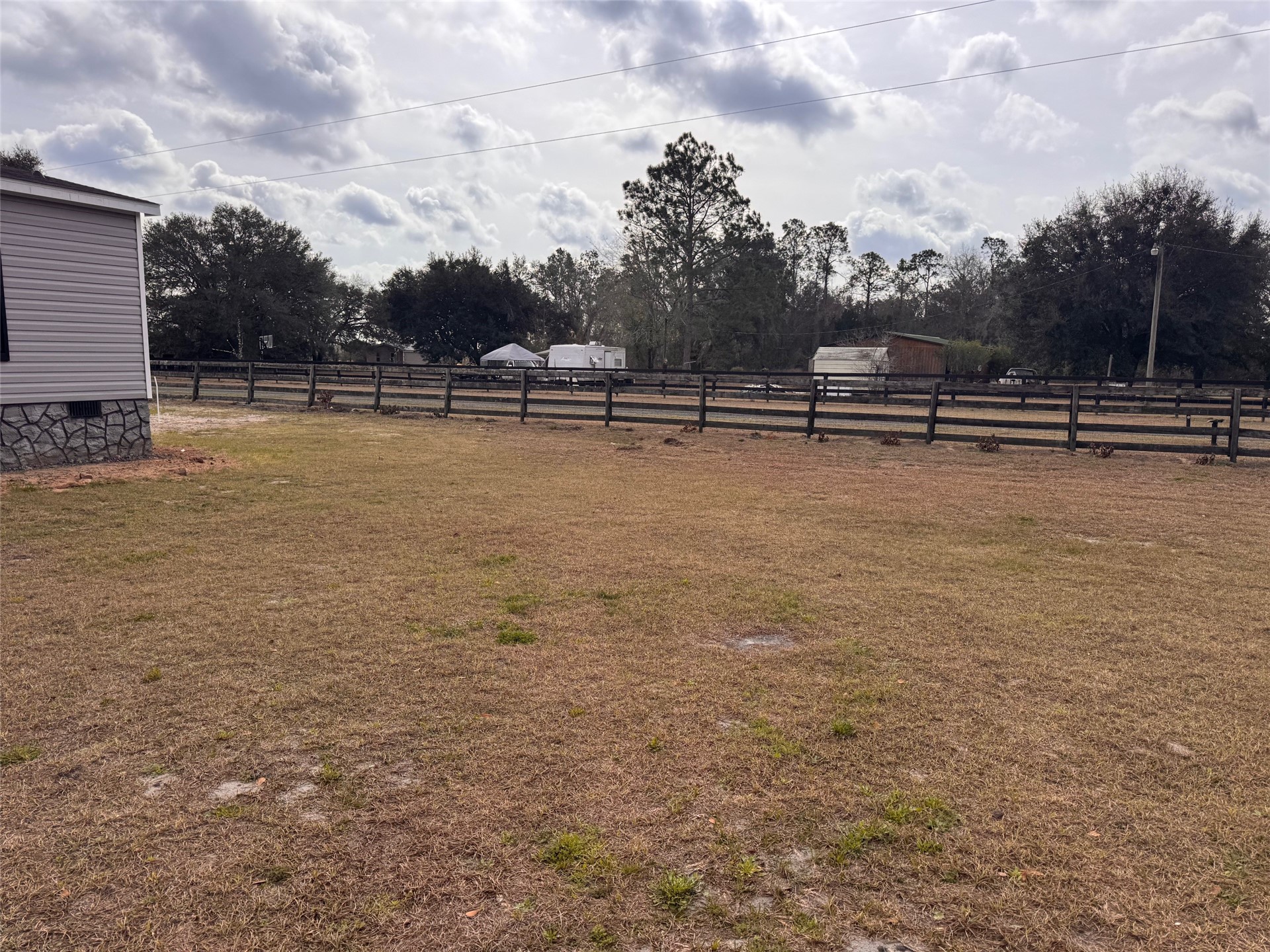 273535 Murrhee Road Hilliard, FL 32046 - Photo 3 of 25 a view of swimming pool with outdoor seating and green space