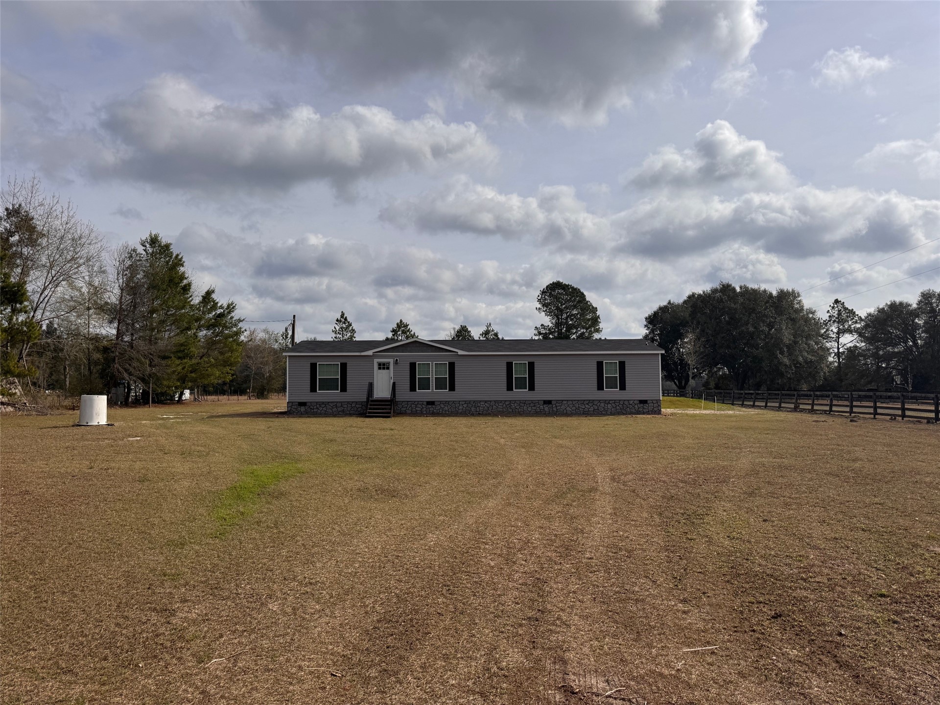 273535 Murrhee Road Hilliard, FL 32046 - Photo 6 of 25 a view of a houses with outside space