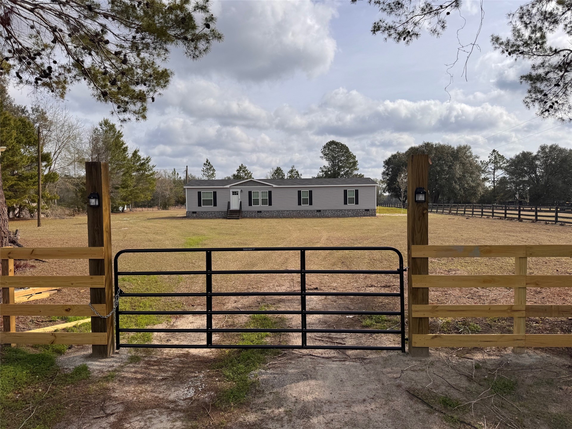 273535 Murrhee Road Hilliard, FL 32046 - Photo 7 of 25 a view of a bench in the middle of a yard